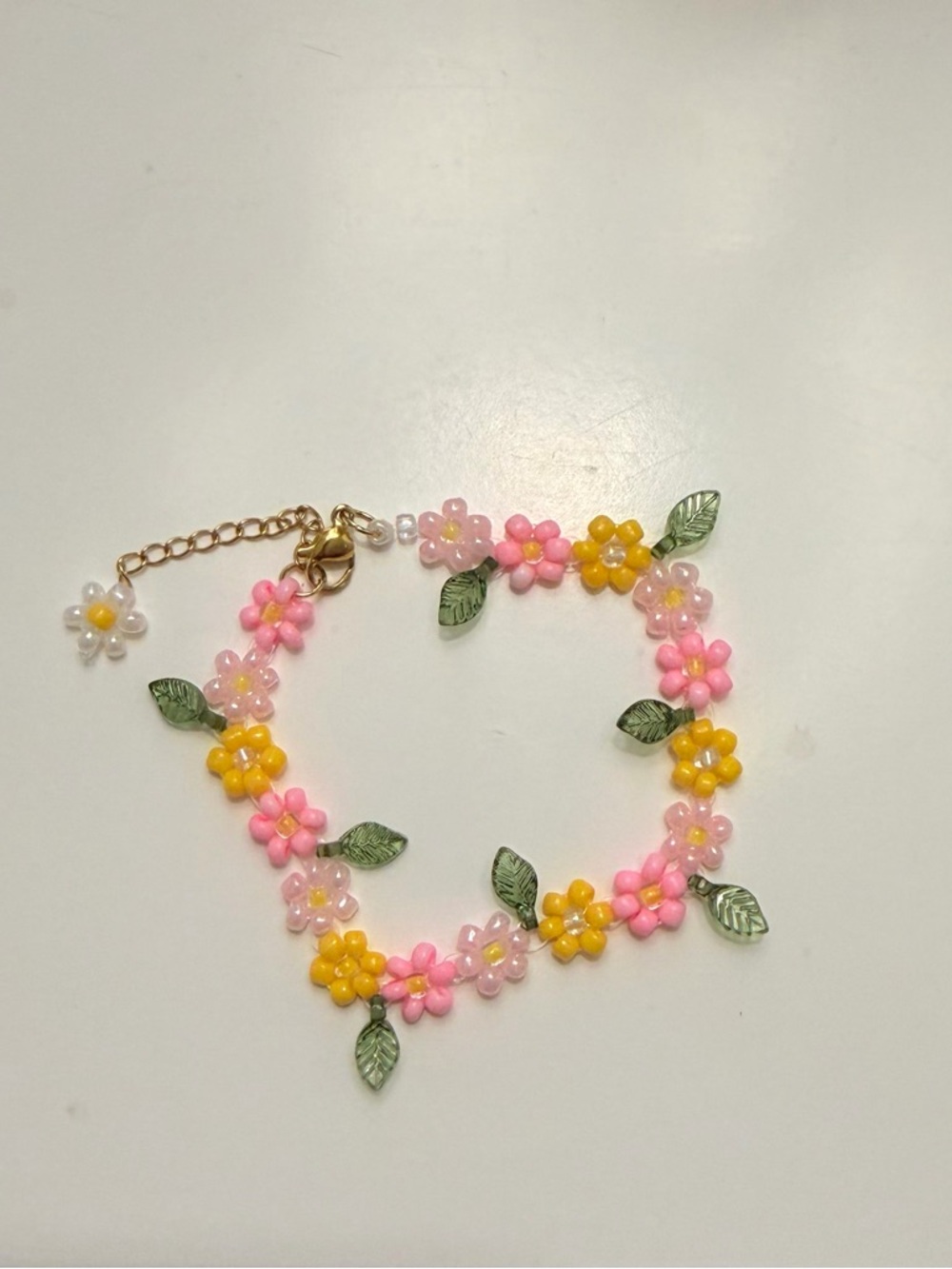 Handmade Pink & Yellow Daisy Beaded Bracelet with Green Leaf Accents